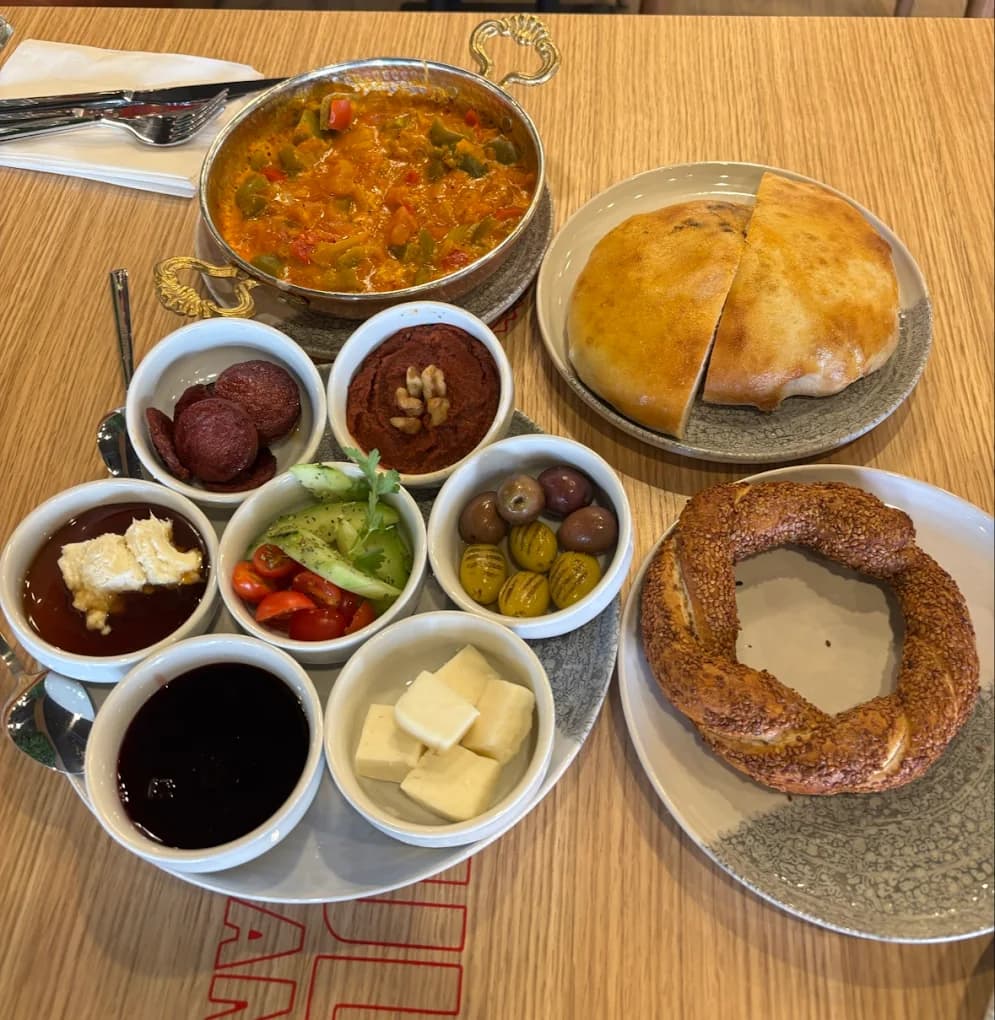 Full Turkish breakfast spread with eggs, cheese, and fresh bread