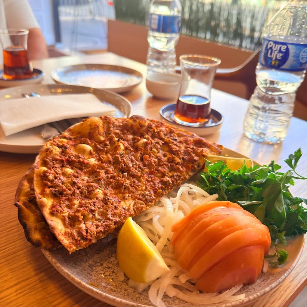 Fresh lahmacun closeup with toppings
