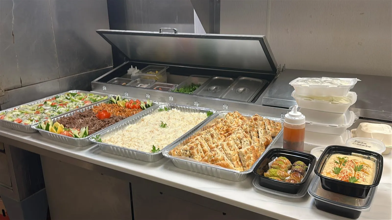 Halal catering trays from Istanbul Mediterranean 2 Las Vegas — salad, doner, rice, pide bread, baklava and hummus ready for delivery